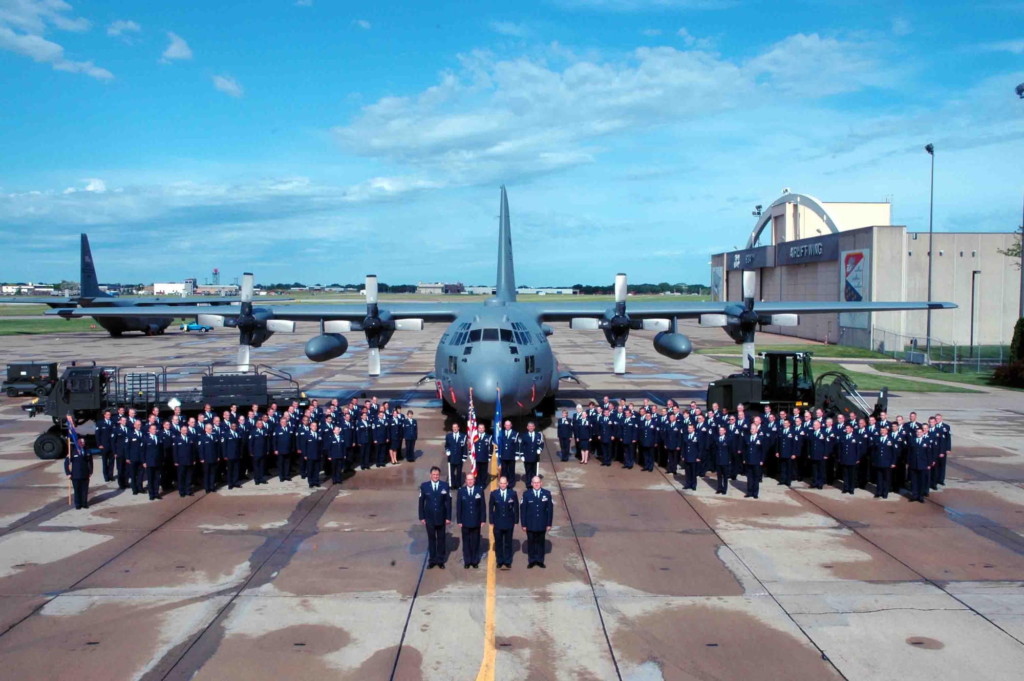 The 27th Aerial Port Squadron poses for a photo on the Minneapolis St. Paul International Airport Air Reserve Station flightline during the June UTA. Air Force Photo/Staff Sgt. Josh Nason.