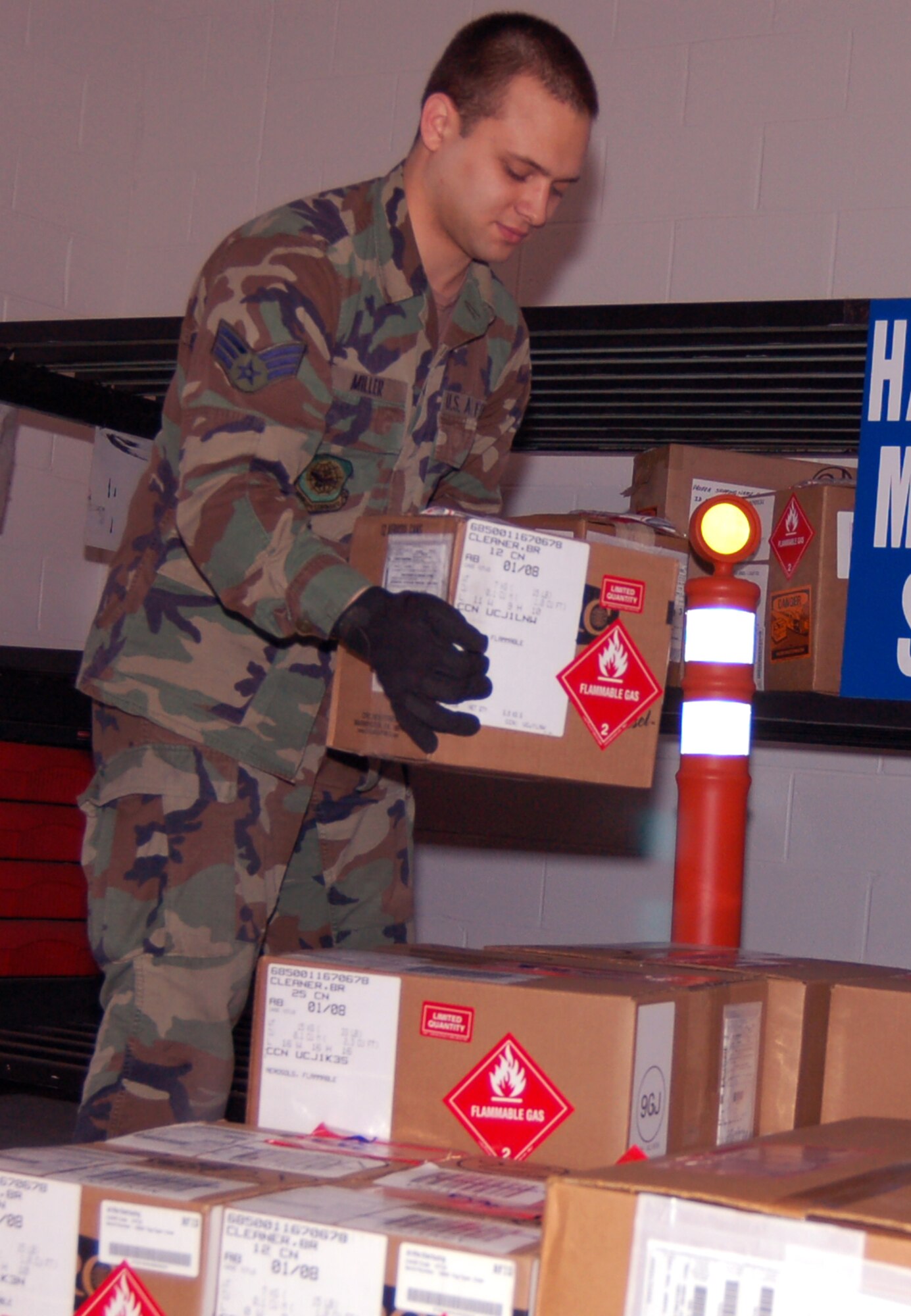 DOVER AIR FORCE BASE, Del. -- Senior Airman David Miller, 436th Aerial Port Squadron special handling, builds a hadardous-materials pallet for shipment Jan. 30. (U.S. Air Force photo/Airman 1st Class Shen-Chia Chu)