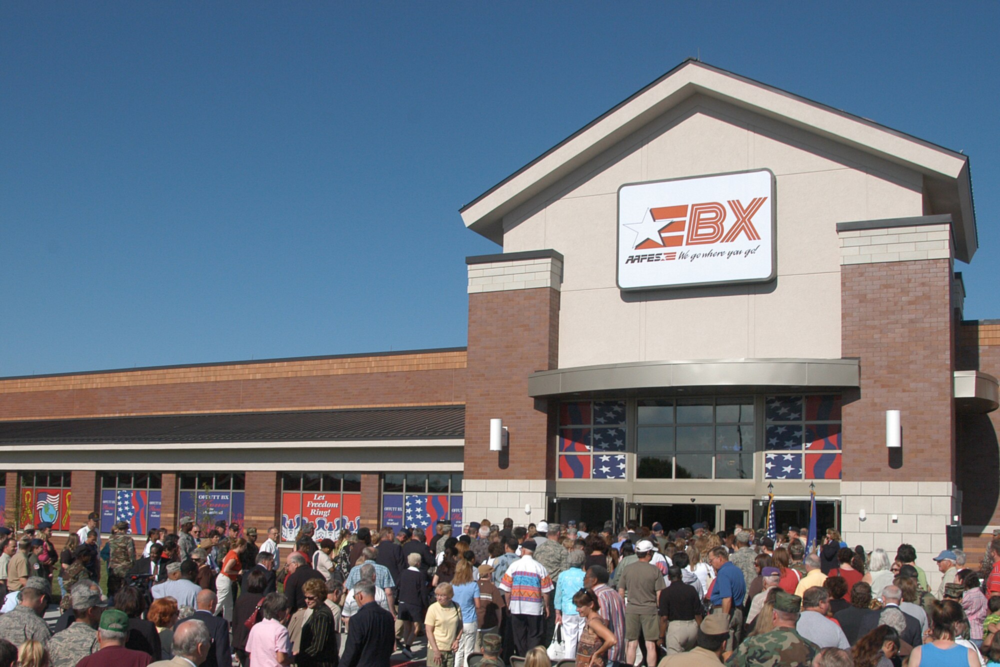 Patrons enter the new base exchange on its opening day. The exchange boasts more square footage of space than the former exchange. (U.S. Air Force Photo By/Jeff Gates)