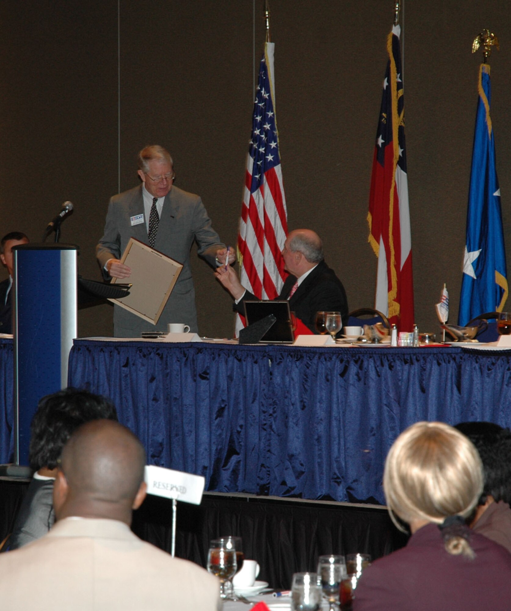 The Georgia Committee for Employer Support of the Guard and Reserve hosted an Employer Appreciation Luncheon at the Georgia International Convention Center on June 25.  The Honorable Governor Sonny Perdue was the guest speaker.  He is seen here with Maj. Gen. (ret) Thom Wessels, GA ESGR state chair, signing a Statement of Support.   Statements of Support were also signed by many of the employers at the luncheon.  More information on Statements of Support can be found at www.esgr.org.  (U.S. Air Force photo/Courtney E. Franchio)