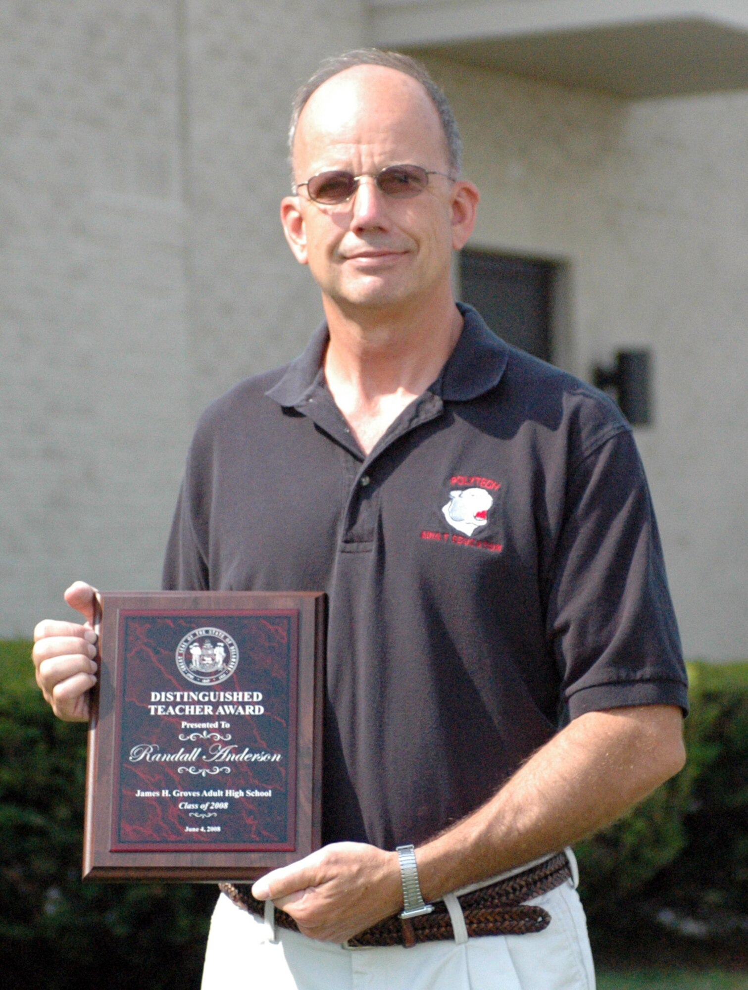 Senior Master Sgt. Randall Anderson, 512th Mission Support Squadron, received Polytech Adult Education's Distinguished Teacher Award June 4. He has worked at the school in Woodside, Del., for the last seven years, serving the past three years as a math teacher. The students nominated Sergeant Anderson for having the biggest impact on their education. (U.S. Air Force photo/Senior Airman Deborah Robinson)