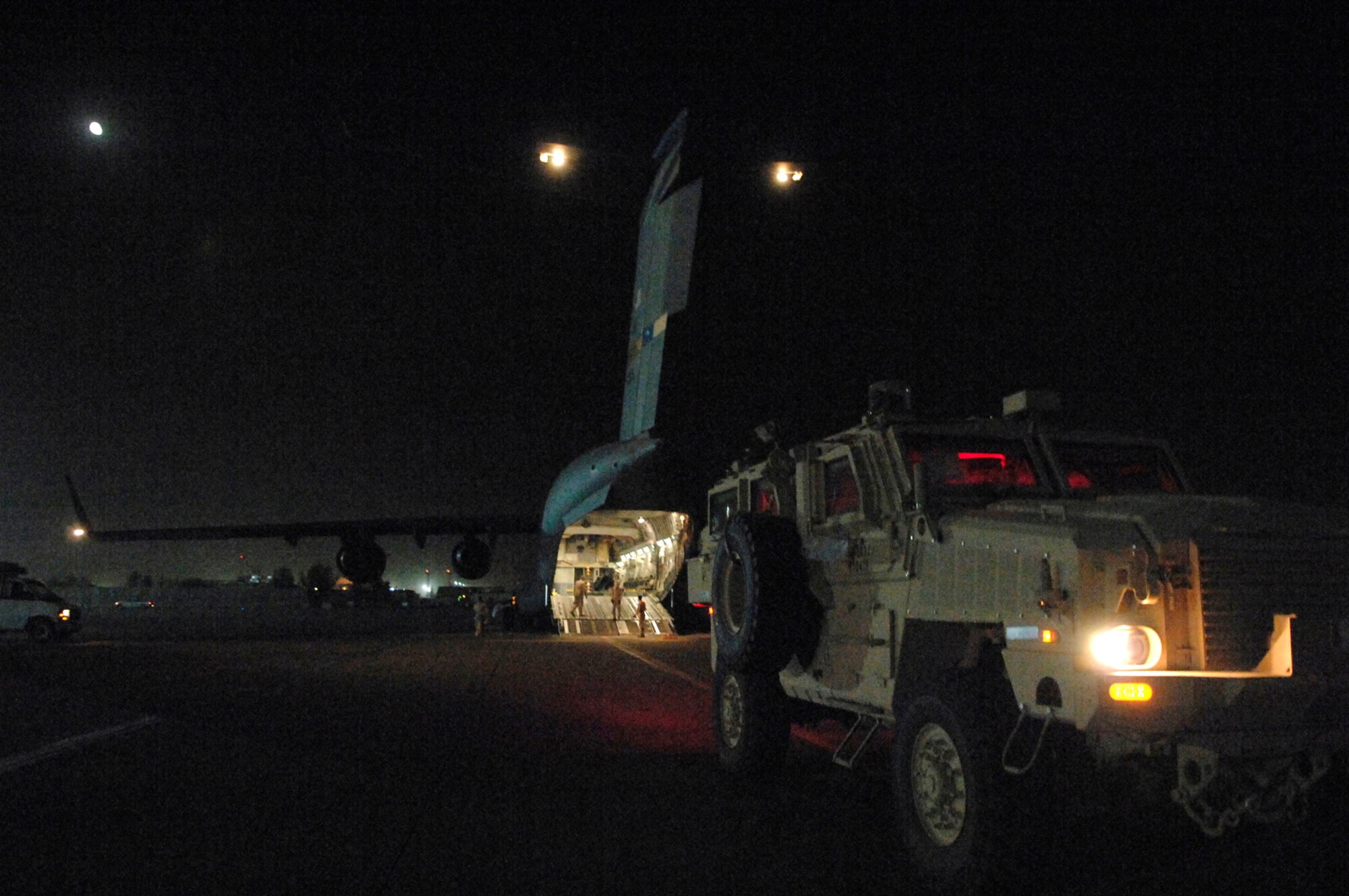 JOINT BASE BALAD, Iraq -- A Mine Resistant Ambush Protected armored vehicle awaits loading onto a C-17 Globemaster III here, June 24. The MRAP vehicles, combined with the right tactics, techniques and procedures, provide the best protection for servicemembers against improvised explosive device attacks. (U.S. Air Force photo/ Senior Airman Julianne Showalter)