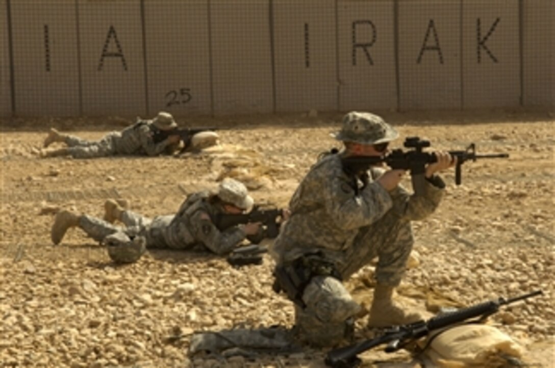 U.S. Army soldiers sharpen their weapons skills at a firing range at Camp Echo, Iraq, on May 24, 2008.  