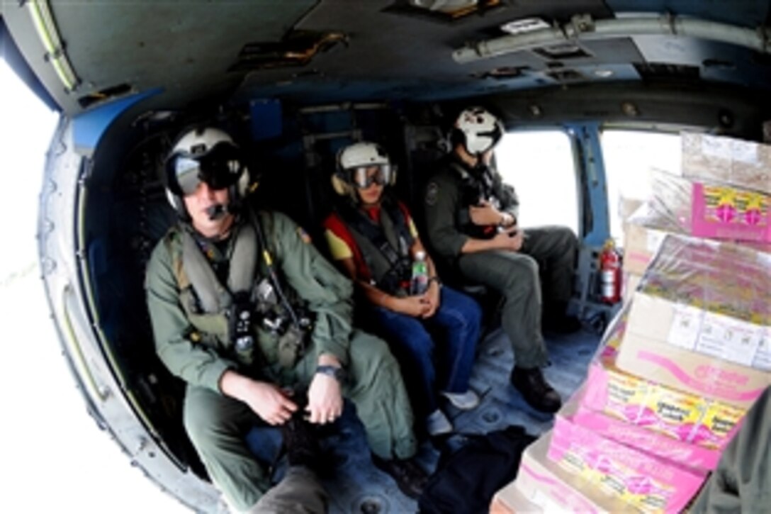 A U.S. Navy air crew delivers food and water to south Panay Island, Philippines, June 27, 2008. U.S. troops have been delivering rice, water, and noodles to help residents affected by Typhoon Fengshen. At the request of the government of the Republic of the Philippines, the Nimitz-class aircraft carrier USS Ronald Reagan is off the coast of Panay Island providing humanitarian assistance.