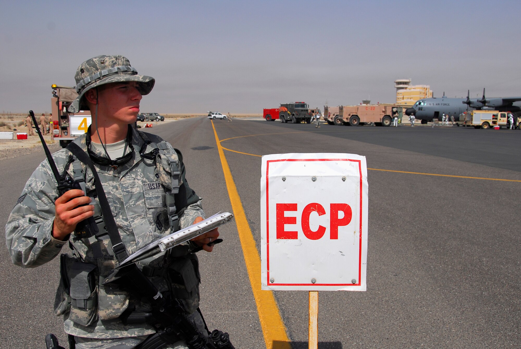 SOUTHWEST ASIA -- Senior Airman Mark Phillips, deployed to the 386th Expeditionary Security Forces Squadron, controls entry for emergency responders as an Entry Control Point guard June 26, 2008, during a major accident response exercise at an air base in the Persian Gulf Region. As a guard at this vital post Airman Phillips ensures only authorized personnel enter the incident scene. The purpose of the MARE is to evaluate the Wing's ability to respond to and recover from an aircraft mishap and mass casualty incident. (U.S. Air Force photo/ Staff Sgt. Patrick Dixon)