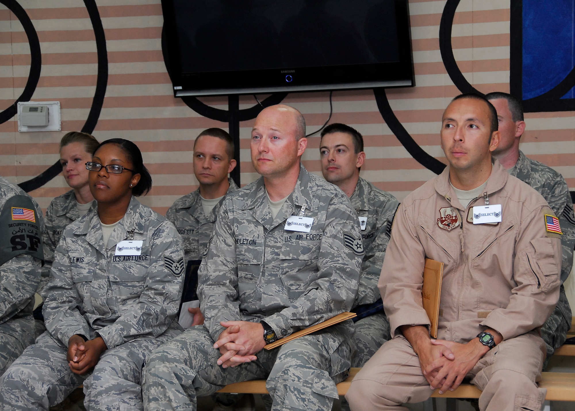 SOUTHWEST ASIA -- A majority of the 67 Airmen recently selected for promotion to master and technical sergeant from the 386th Air Expeditionary Wing listen to Col. Robert Swisher, 386th AEW commander talk about this monumental occasion in their careers and what it means to the Air Force during a ceremony here June 27. (U.S. Air Force photo/Staff Sgt. Patrick Dixon)