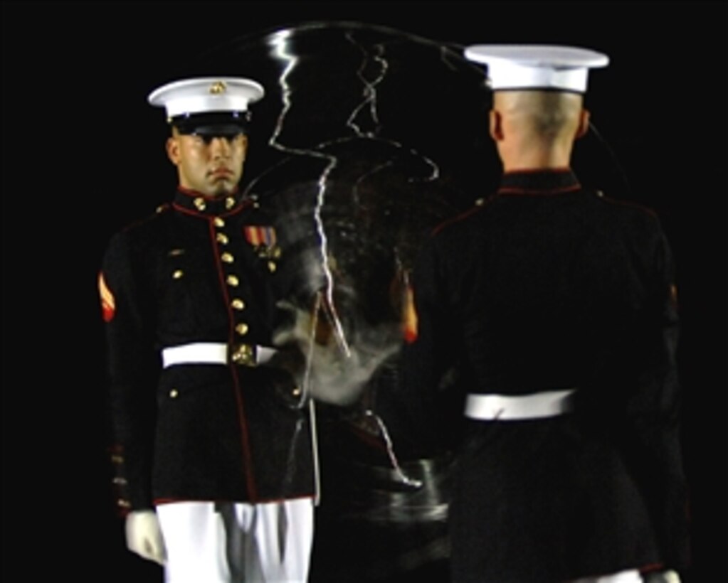 Members of the U.S. Marine Corps Silent Drill Platoon spin rifles during the evening parade at Marine Barracks Washington, D.C., June 27, 2008. Marine Gen. Jame E. Cartwright, vice chairman of the Joint Chiefs of Staff, was the host for the parade. 