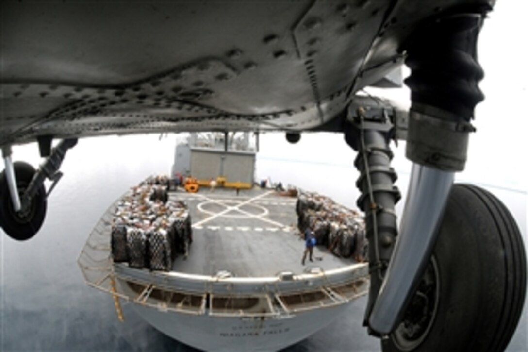 A U.S. Navy HH-60H Seahawk helicopter from Helicopter Anti-Submarine Squadron 4 lifts another pallet of bottled water from the deck of Military Sealift Command combat stores ship USNS Niagara Falls for delivery to Kalibo, Republic of the Philippines, Pacific Ocean, June 29, 2008. Kalibo, which lies on the northern tip of Panay Island, was hit hard by Typhoon Fengshen. 
