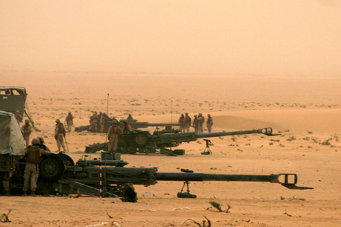 CAMP BUEHRING, Kuwait (July 3, 2008)--Marines from India Battery, Battalion Landing Team 2/5, 15th Marine Expeditionary Unit, place their M777 155mm Howitzers in preparation for a training range here.::r::::n::Throughout their two-day training evolution, India Battery practiced the fundamentals of artillery firing roughly 100 rounds on the range.::r::::n::The Camp Pendleton, Calif., based 15th MEU is currently in Kuwait conducting sustainment training. (Official USMC Photo by Staff Sgt. TG Kessler)::r::::n::