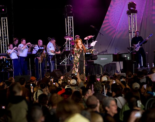 ELMENDORF AIR FORCE BASE, Alaska -- Country Singer Wynonna Judd and the U.S. Air Force Band of the Pacific perform a free concert for the members of the military and Alaska crowd in Hanger 2 during "Alaska's Concert for the Military" June 27, as part of the Alaska's 50th Statehood celebration. (U.S Air Force photo byTech. Sgt. Alan Port)