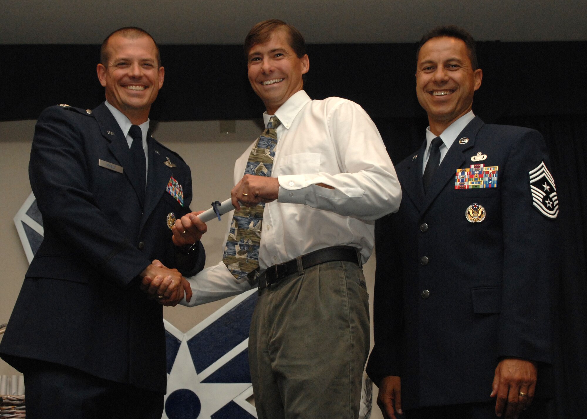 Holloman Air Force Base honors volunteers during the annual Volunteer Recognition Ceremony, June 27 at the Desert Sands Enlisted Club Holloman at Air Force Base, N.M. The ceremony is held to recognize those who volunteered between April 2007 and April 2008. This year the volunteers contributed more than 24,350 hours, which would equate to $158,321,00 if working for minimum wage. The Volunteers spent time at various places and events toinclude; the Holloman AFB Chapel, medical group, Boys and Girls Scouts, Thrift Shop, Airman's Attic, Youth and Teen Center Sports Program, Day of Caring, 572- Ride, Highway Clean-up, Special Oplymics, Big Brothers and BigSisters and many more.(U.S. Air Force photo/ SrA Tiffany Trojca)