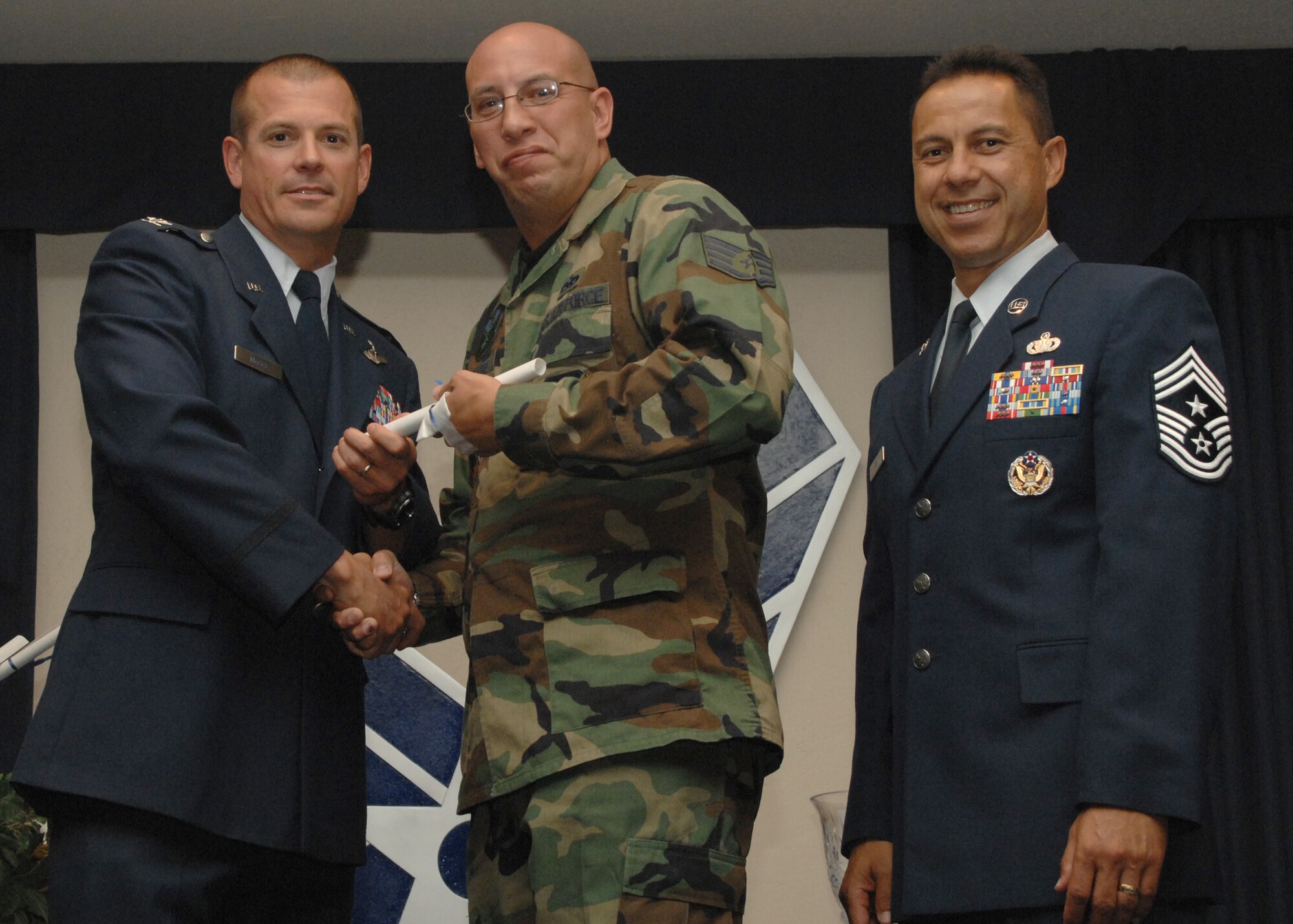 Holloman Air Force Base honors volunteers during the annual Volunteer Recognition Ceremony, June 27 at the Desert Sands Enlisted Club Holloman at Air Force Base, N.M. The ceremony is held to recognize those who volunteered between April 2007 and April 2008. This year the volunteers contributed more than 24,350 hours, which would equate to $158,321,00 if working for minimum wage. The Volunteers spent time at various places and events toinclude; the Holloman AFB Chapel, medical group, Boys and Girls Scouts, Thrift Shop, Airman's Attic, Youth and Teen Center Sports Program, Day of Caring, 572- Ride, Highway Clean-up, Special Oplymics, Big Brothers and BigSisters and many more.(U.S. Air Force photo/ SrA Tiffany Trojca)
