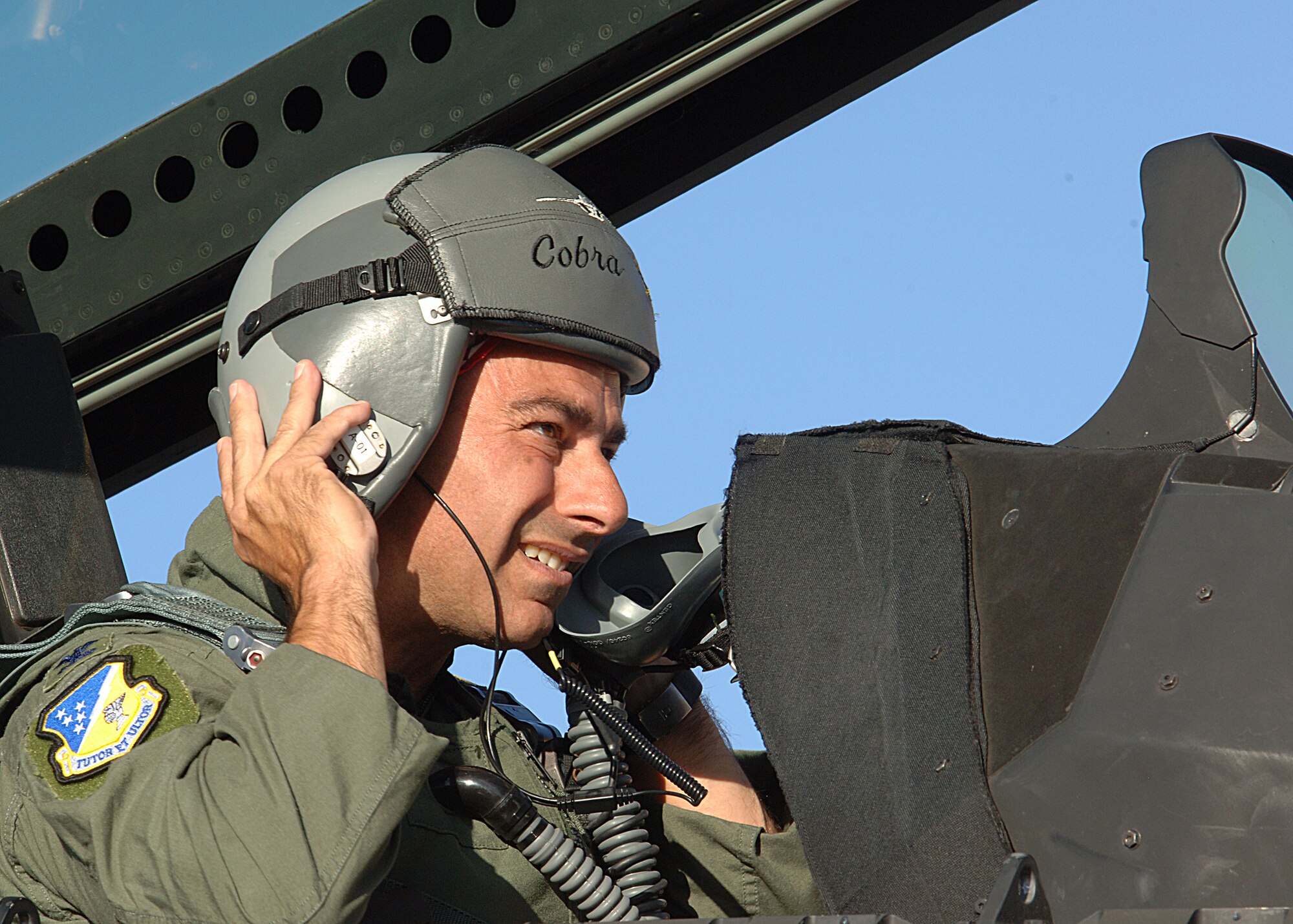 Col. Jeff Harrigian commander of the 49th Fighter Wing straps on his helmet in preparation for his flight in an F-22A Raptor at Holloman Air Force Base, N.M.  (U.S. Air Force photo/Airman 1st Class John Strong) 
  