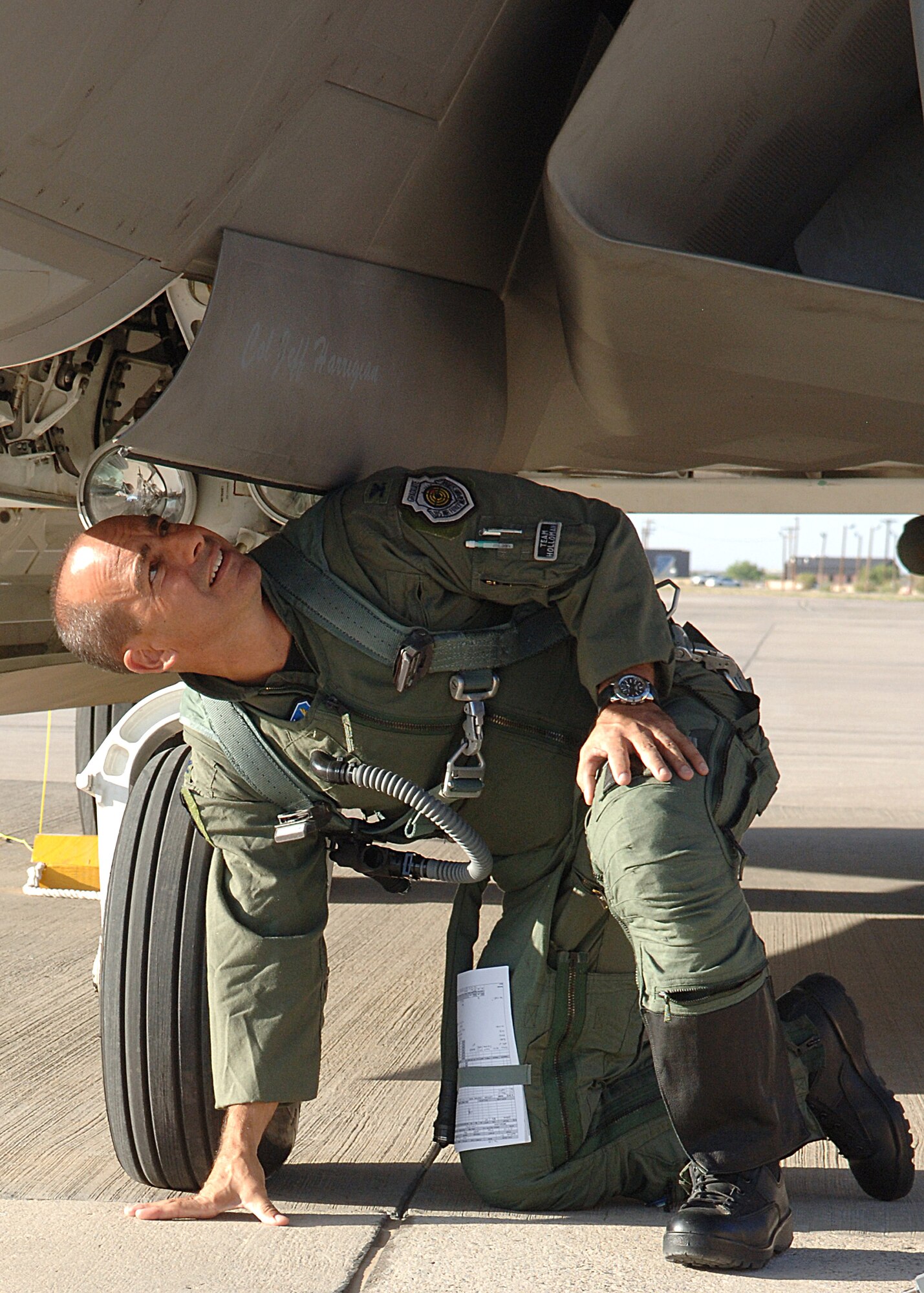 Col. Jeff Harrigian, commander of the 49th Fighter Wing inspects an F-22A Raptor before his flight at Holloman Air Force Base, N.M., .  (U.S. Air Force photo/Airman 1st Class John Strong) 
  