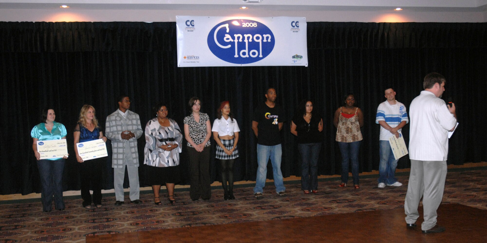 CANNON AIR FORCE BASE, N.M. - The 10 contestants of Cannon Idol receive accolades after the event concluded at the Landing June 28. The singing competition was held in front of an audience of peers, friends and family and judged by Col. Timothy Leahy, 27th Special Operations Wing commander, 27th SOW Command Chief Master Sgt. Daniel Fischer, and Staff Sgt. Naomi Brown, 27th Special Operations Maintenance Operations Squadron. (U.S. Air Force photo/Airman 1st Class Danielle Martin)