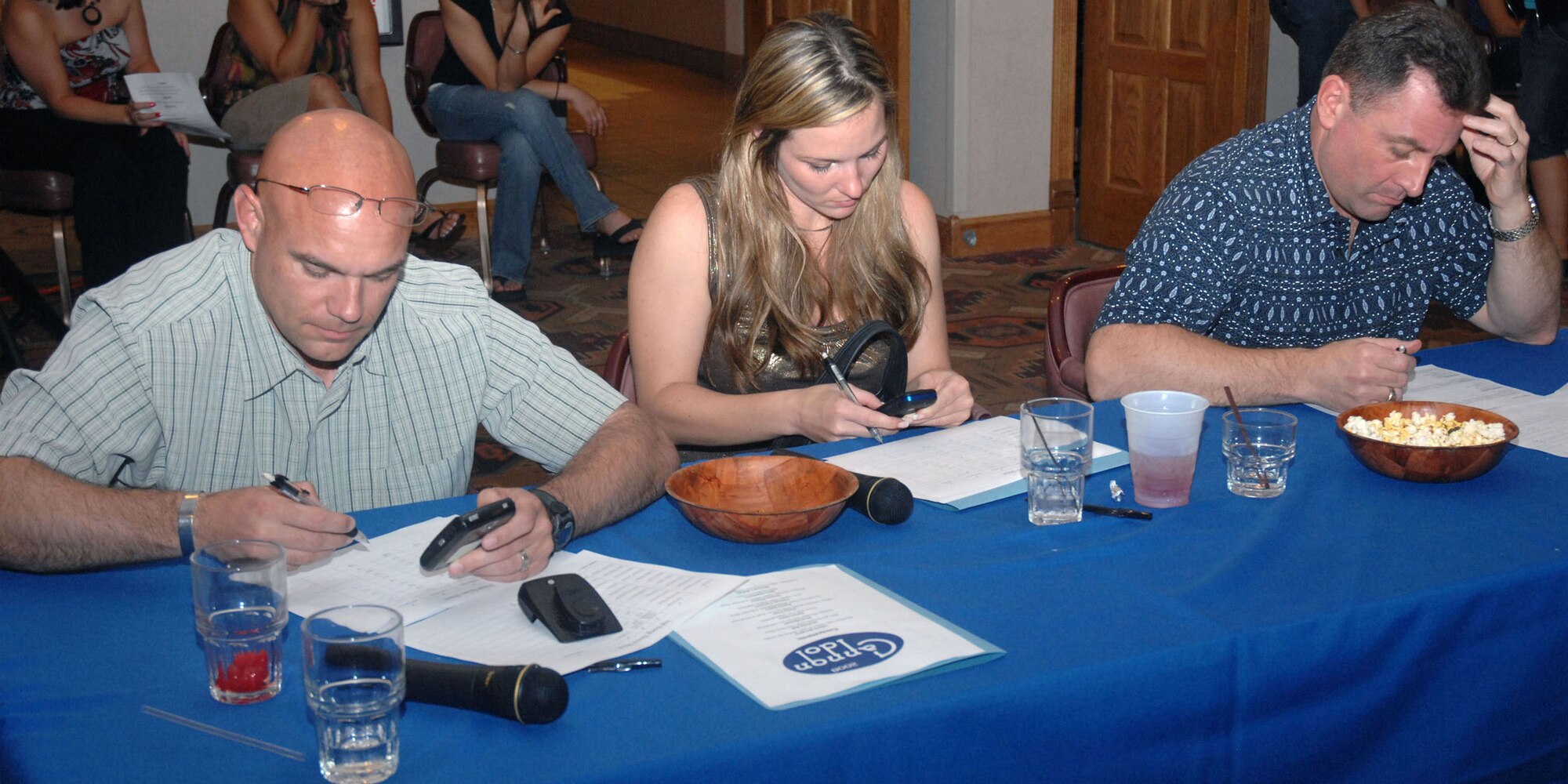 CANNON AIR FORCE BASE, N.M. - (From left) 27th Special Operations Wing Command Chief Master Sgt. Daniel Fischer, Staff Sgt. Naomi Brown, 27th Special Operations Maintenace Operations Squadron, and Col. Timothy Leahy, 27th SOW commander, all took part in judging the 10 contestants during Cannon Idol June 27. The first place winner in the singing competition was Ms. Ashley Balter, runner up Ms. Sharon Dictson, and third place winner Senior Airman Adrian Ables, 27th Special Operations Aircraft Maintenace Squadron.