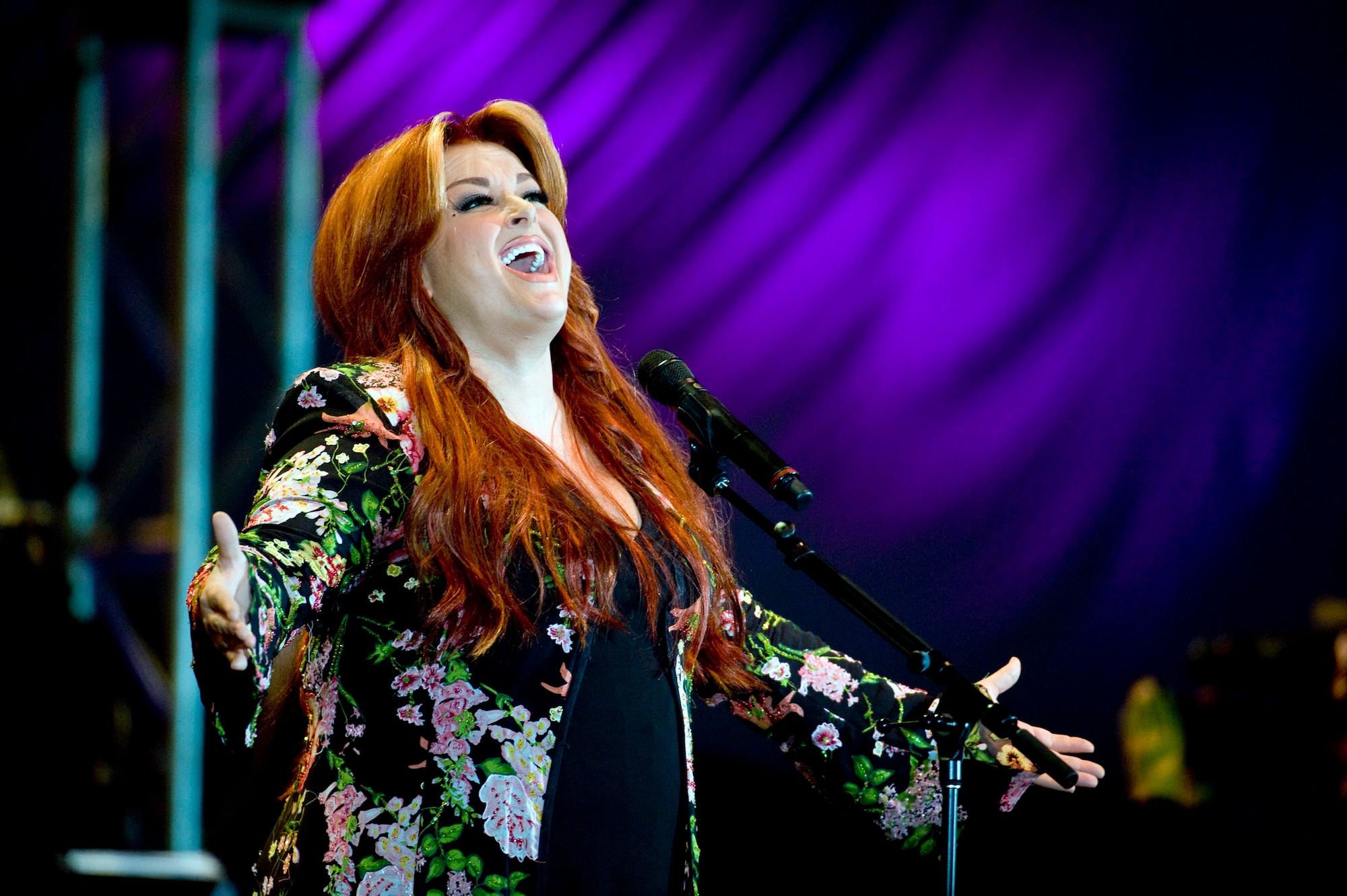 Wynonna Judd performs for the military and civilian crowd at Alaska's Operation Gratitude concert June 27 at Elmendorf Air Force Base, Alaska. The concert was the official kick off to the "We're In" weekend, celebrating Alaska's 50 years of statehood. More than 10,000 people attended the event. (U.S. Air Force photo/Senior Airman Jonathan Steffen) 