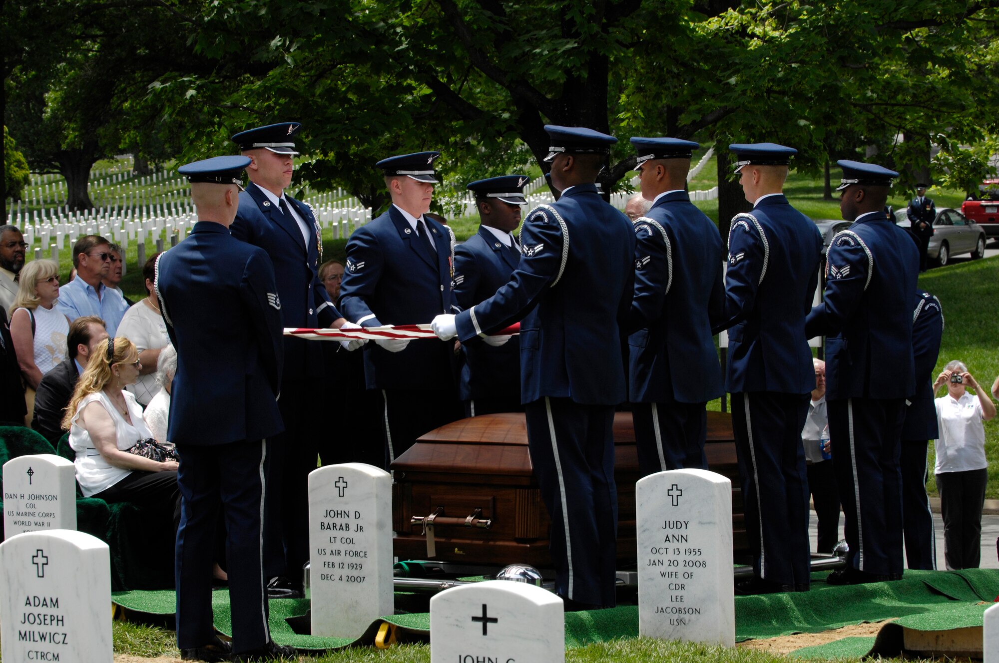 An Air Force honor guard folds the American flag over the casket of  Senior Master Sgt. James Caniford, 16th Special Operations Squadron, who was buried May 28 in Arlington National Cemetery. Sergeant Caniford, who was missing in action from the Vietnam War, was recently identified. (U.S. Air Force photo/Senior Airman Marleah Miller) 
