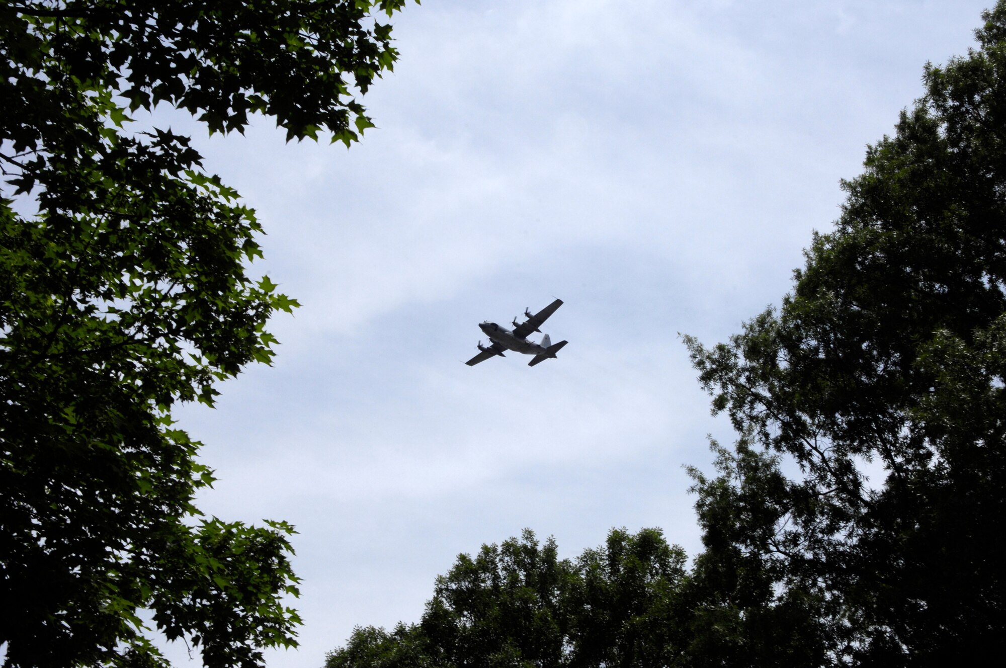 An AC-130H Spectre gunship from the 16th Special Operations Squadron conducts a flyover at Arlington National Cemetary during a memorial service for Senior Master Sgt. James Caniford May 28. Sergeant Caniford, a former 16th SOS illuminator operator, was recently identified after more than 30 years listed as missing in action from the Vietnam War. (U.S. Air Force photo/Senior Airman Marleah Miller) 