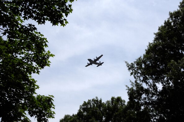An AC-130H Spectre gunship from the 16th Special Operations Squadron conducts a flyover at Arlington National Cemetary during a memorial service for Senior Master Sgt. James Caniford May 28. Sergeant Caniford, a former 16th SOS illuminator operator, was recently identified after more than 30 years listed as missing in action from the Vietnam War. (U.S. Air Force photo/Senior Airman Marleah Miller) 