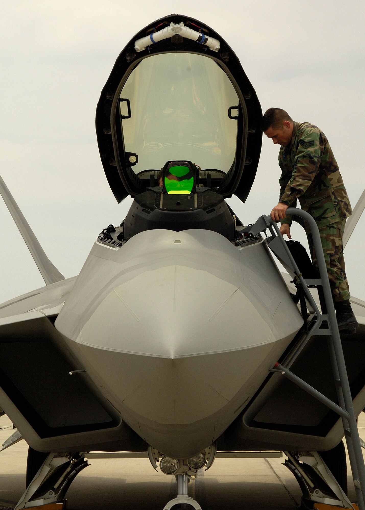 Senior Airman Audrey Howell, 49th Aircraft Maintenance Squadron crew chief, prepares an F-22A Raptor for a sortie at Holloman Air Force Base, N.M., June 25. (U.S. Air Force photo/Airman 1st Class Michael Means)