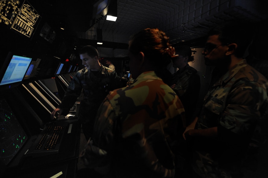 Cadets from the U.S Air Force Academy explore the Radar Approach Control center during a tour of Moody Air Force Base June 25.  Six cadets from the academy are visiting moody as part of Operation Air Force, a program that allows students to experience the operational Air Force outsided of the rigorous training and classroom environment of the academy.  (U.S. Air Force photo by Senior Airman Gina Chiaverotti)