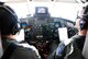 RC-26 Pilots Lt Col Scott Craver (left) from the 186th Air Refueling Wing, Meridian, MS and Lt Col Steve Dunai from the 115th Fighter Wing, Madison, WI fly an initial flood awareness assessment mission in the skies over Wisconsin June 10th, 2008.  This RC-26 aircraft is specifically designed for viewing and transmitting high quality video and still imagery to military and civilian Operations Centers in real-time.  The imagery captured during this mission was used to assess the integrity of several area Dams in addition to providing flood damage assessment in the hardest hit regions of the southern half of the state.  The capabilities of this aircraft give military commanders and civilian first responders a bird's eye view of significant events as they happen. (U.S Air Force hoto by  Master Sgt. Daniel Richardson)