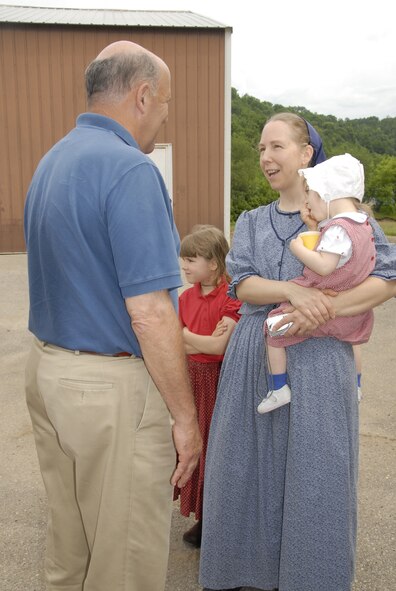 Wisconsin State Governor Jim Doyle stops to speak with residents of the town of Soldiers Grove, WI while conducting a flood damage assessment of southern Wisconsin on June 11, 2008. Serious flooding throughout the State of WI prompted the governor to declare a state of emergency, allowing the State Adjutant General, Brigadier General Don Dunbar to activate National Guard troops to assist in the relief effort.   (US Air National Guard photo by MSgt Paul Gorman) (RELEASED)