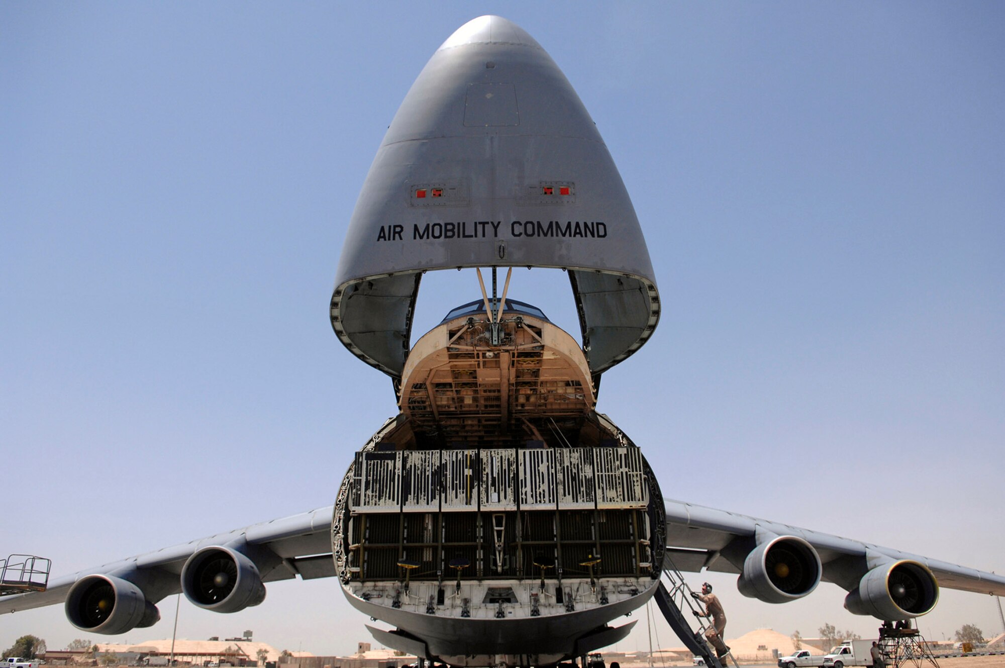 A C-5 Galaxy sits with its nose up before loading an Army Stryker Infantry Carrier Vehicle June 25 at Joint Base Balad, Iraq. The final destination for the tactical vehicle is the Anniston Army Depot, Ala. (U.S. Air Force photo/Senior Airman Julianne Showalter)