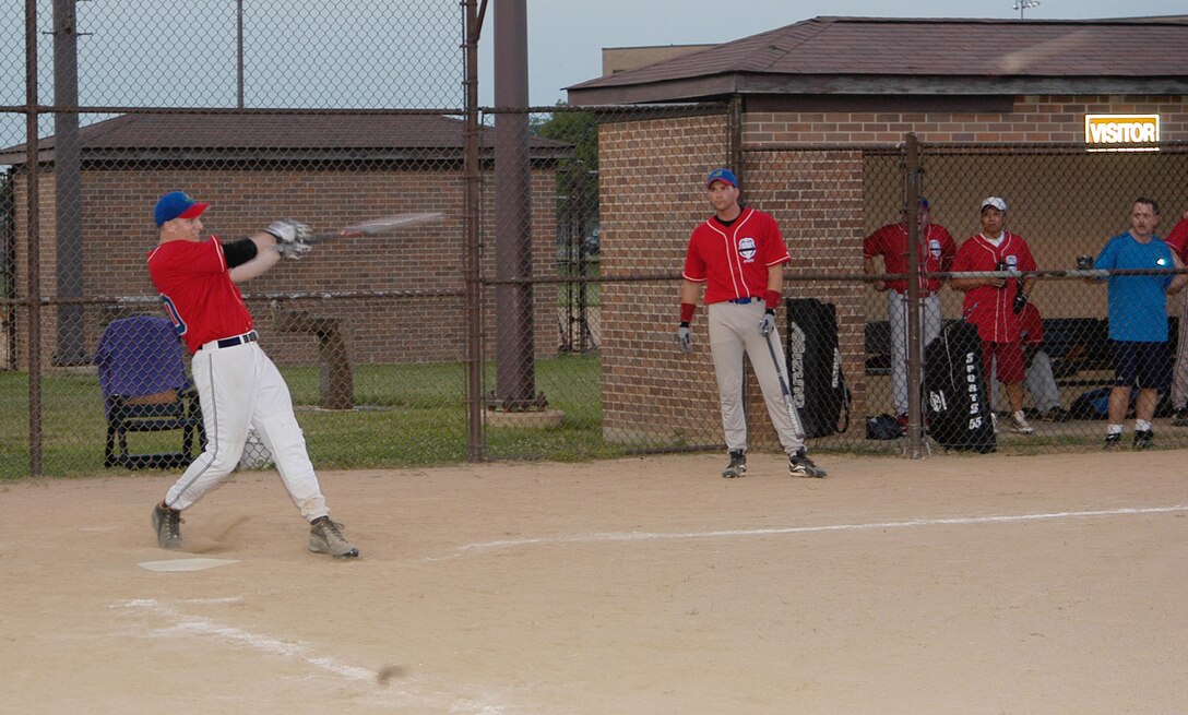 AFOSI Gators' third baseman Joe Kasper sends a line drive screaming into center for a single. The Gators took two games from 744th COMM. The final scores were 10-0 and 12-7 in the Gators favor. (U.S. Air Force photo/Tech. Sgt John Jung) 