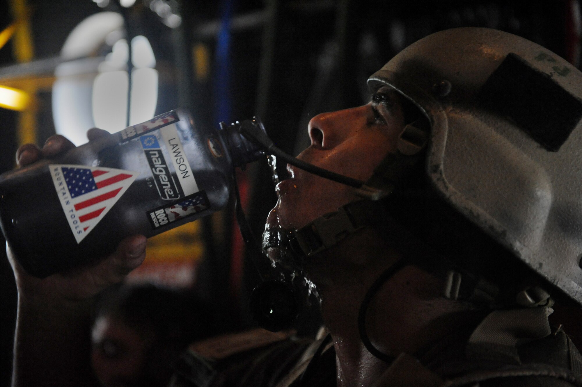 MOODY AIR FORCE BASE, Ga. -- Staff Sgt. Daniel Houghton, 38th Rescue Squadron pararescueman, hydrates after loading patients from an aircraft crash onto an HC-130P King during a mass-casualty exercise here June 27. Twenty-five mock patients were loaded on to the aircraft to be medically evacuated as part of the exercise. (U.S. Air Force photo by Senior Airman Gina Chiaverotti)