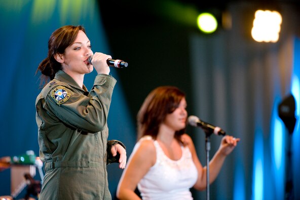 ELMENDORF AIR FORCE BASE, Alaska -- Capt. Lyndsey Goodman, 317th Airlift Squadron and contestant on American Idol, performs to the military and Alaska crowd at the "Alaska's Operation Gratitude" concert June 27 at Hangar 2. The concert was a part of Alaska's 50 years of statehood celebration. (U.S. Air Force photo/Senior Airman Jonathan Steffen) 
