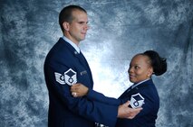 MINOT AIR FORCE BASE, N.D. -- Tech. Sgt. Steven Mayne, 741st Missile Squadron missile alert facility manager, and his wife, Tech. Sgt. Sharon Mayne 741st MS chef non-commissioned officer in charge, pose for a photo celebrating making the rank of master sergeant together June 30. (U.S. Air Force photo by Airman 1st Class Wesley Wright)