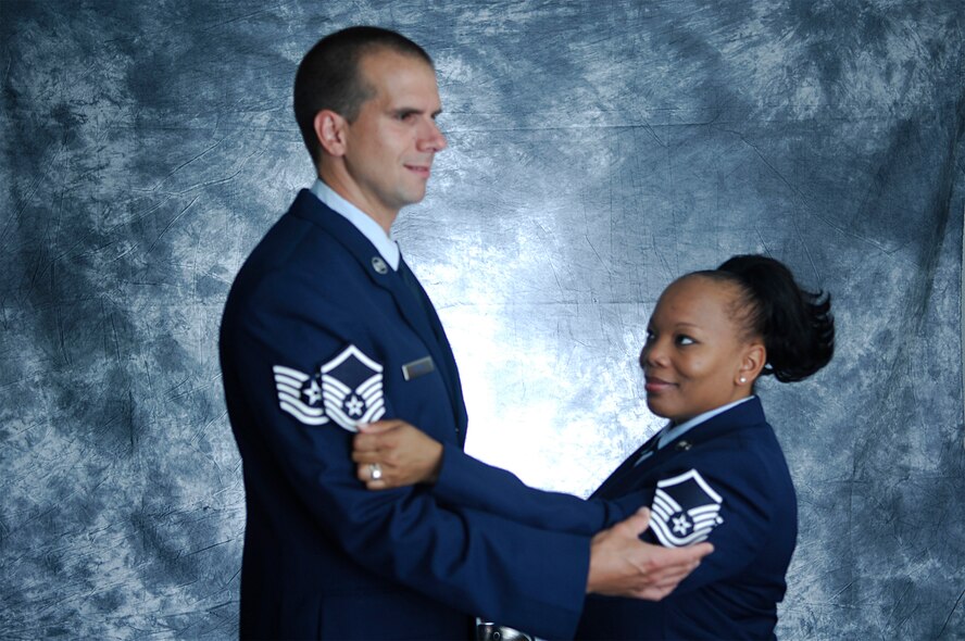 MINOT AIR FORCE BASE, N.D. -- Tech. Sgt. Steven Mayne, 741st Missile Squadron missile alert facility manager, and his wife, Tech. Sgt. Sharon Mayne 741st MS chef non-commissioned officer in charge, pose for a photo celebrating making the rank of master sergeant together June 30. (U.S. Air Force photo by Airman 1st Class Wesley Wright)