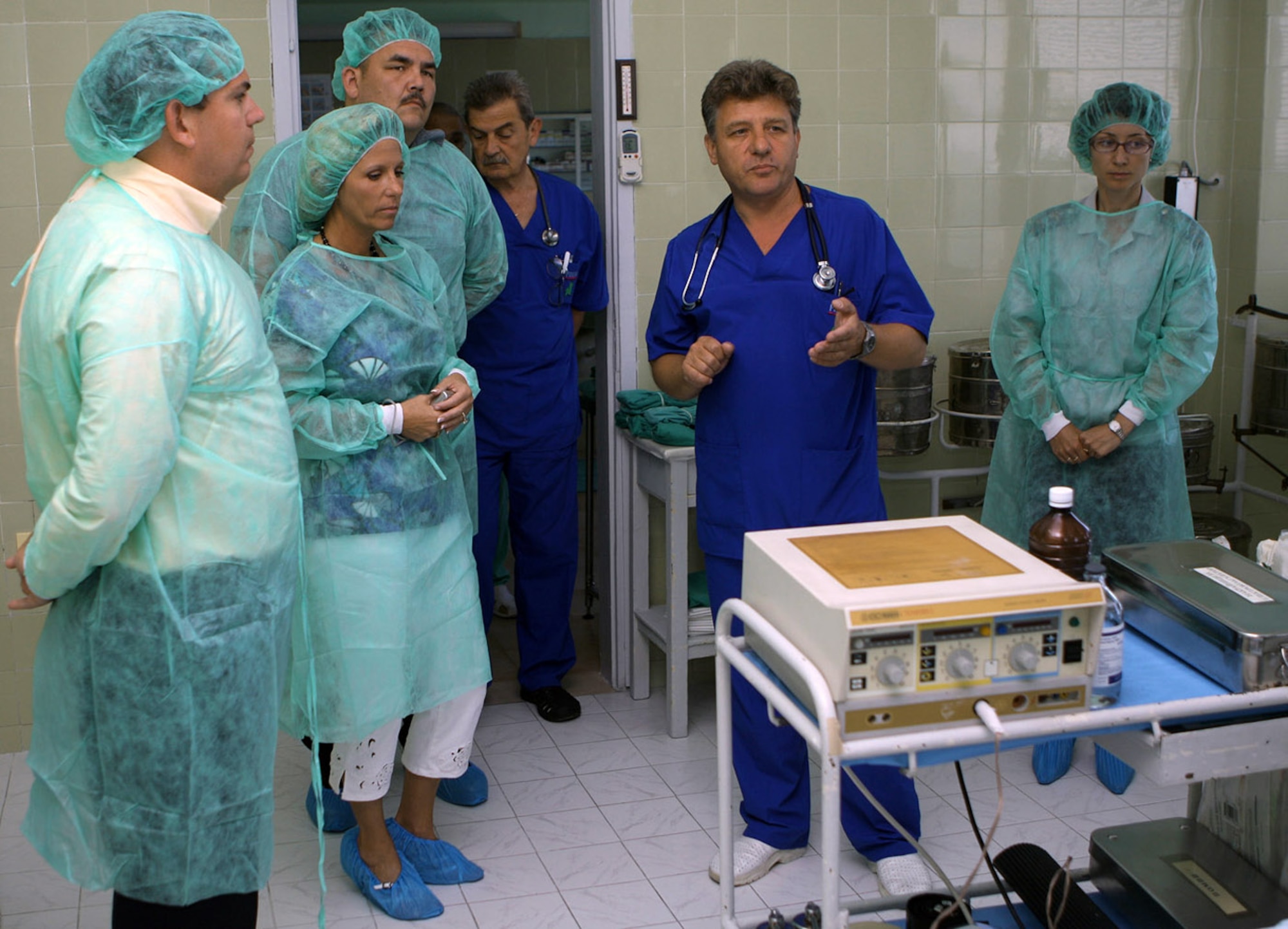 Dr. Stefan Lazarov (second from right) gives a tour of the children's ward to Chaplain (Maj.) Vincent Cummings, Senior Master Sgt. Honey Lane and Tech. Sgt. Errol Johnson June 23 at a hospital in Plovdiv, Bulgaria. Approximately 200 Airmen Homestead Air Reserve Base, Fla., deployed to train with the Bulgarian air force. The Airmen raised $2,800 to purchase a medical device for the children's ward that is useful for patients with respiratory or cardiac problems. Dr. Lazarov is from the Medical University in Plovdiv, Bulgaria. Chaplain Cummings is a 482nd Fighter Wing chaplain, Sergeant Lane is the 93rd Fighter Squadron first sergeant and Sergeant Johnson is a 93rd FS aerospace medical technician. (U.S. Air Force photo/Tech. Sgt. Bucky Parrish) 
