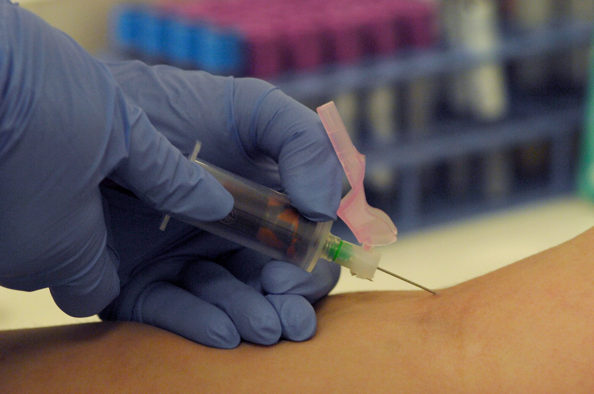 AVIANO AIR BASE, Italy --  Staff Sgt. Tiffany Woods, 31st Medical Operations Squadron, draws blood from Staff Sgt. Holly Loria's arm during her Preventitive Health Assessment June 26.  All active duty members must have their blood drawn each year to be tested for HIV, Gonorrhea, Chlamydia, and Cholesterol.  (U.S. Air Force photo/Airman 1st Class Ashley Wood)   