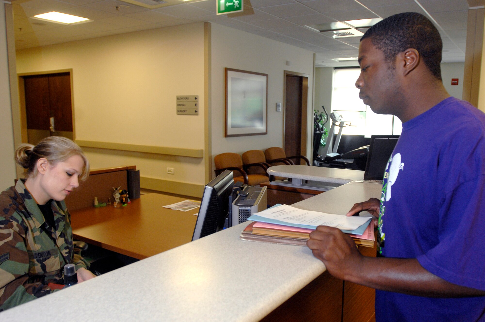 AVIANO AIR BASE, Italy --  Airman 1st Class Victoria Denton, 31st Medical Operations Squadron, checks in Senior Airman Ardell Reeves Jr. for his Preventitive Health Assessment June 26.  PHA's are conducted each year to ensure Airmen are always deployment ready.  (U.S. Air Force photo/Airman 1st Class Ashley Wood)