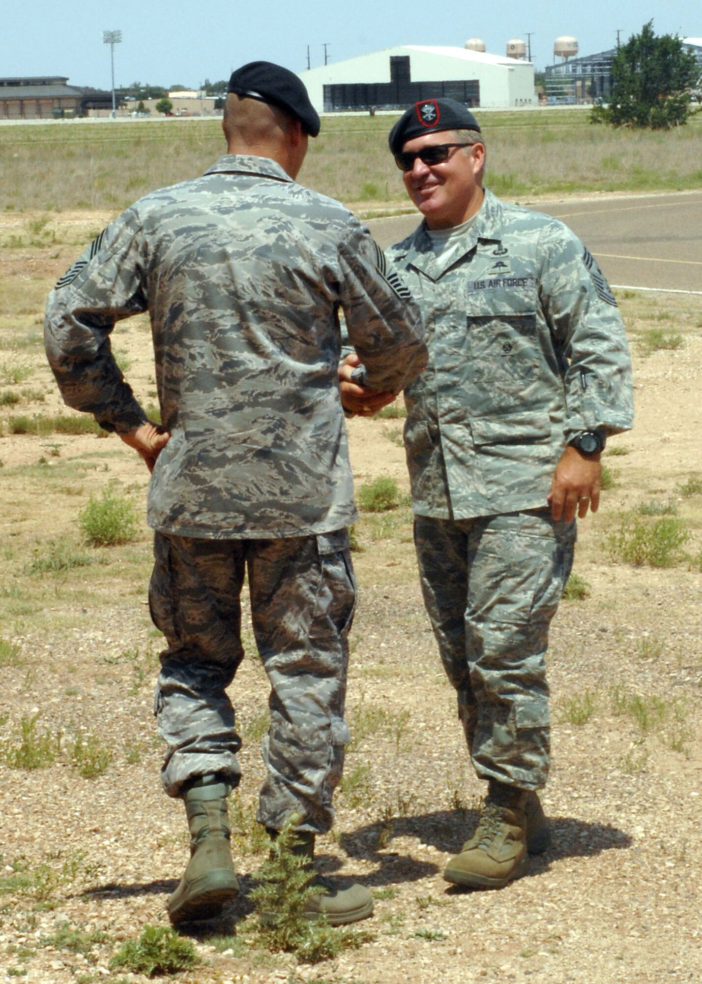 CANNON AIR FORCE BASE, N.M.-- Chief Master Sgt. Jeffrey Howard (left), 27th Special Operations Security Forces Squadron, welcomes Chief Master Sgt. Michael P. Gilbert, Air Force Special Operations Command chief June 26.  Chief Gilbert toured Cannon since becoming the AFSOC command chief. (U.S. Air Force photo/Airman 1st Class Evelyn Chavez)