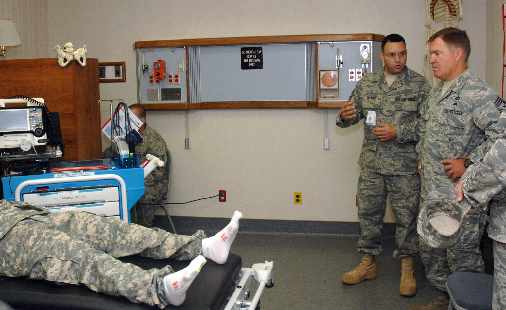 CANNON AIR FORCE BASE, N.M. -- Tech. Sgt. Aramis Cedeno, 27th Special Operations Medical Support Squadron, briefs Chief Master Sgt. Michael P. Gilbert, Air Force Special Operations Command chief, June 26. Chief Gilbert made several stops to different flights across base during his visit here. (U.S. Air Force photo/Airman 1st Class Evelyn Chavez)