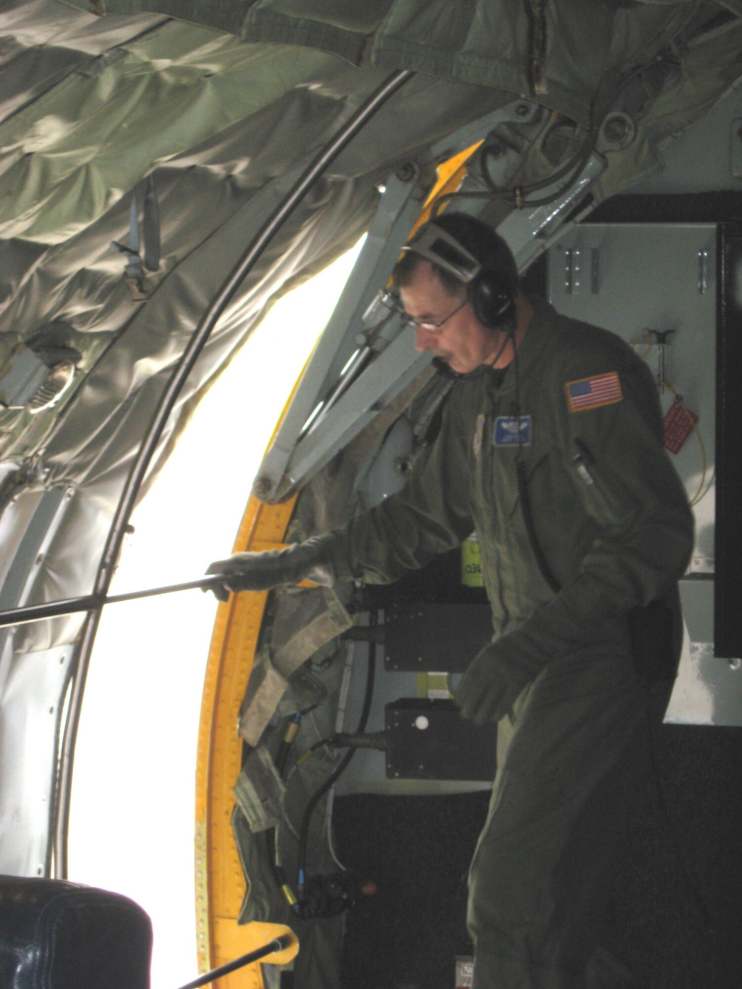 Chief Master Sgt Samuel Davies boom operator on the KC-135R shuts the side hatch before take off. Fuzzy 01 cleared for takeoff. The KC-135R Stratotanker rolled down runway 28 Right for its final takeoff out of Niagara Falls Air Reserve Station with the 107th Airlift Wing, New York Air National Guard, ending the unit's legacy as an air refueling wing. (U.S. Air Force Photo/Lt. Col. Deanna Miller)

