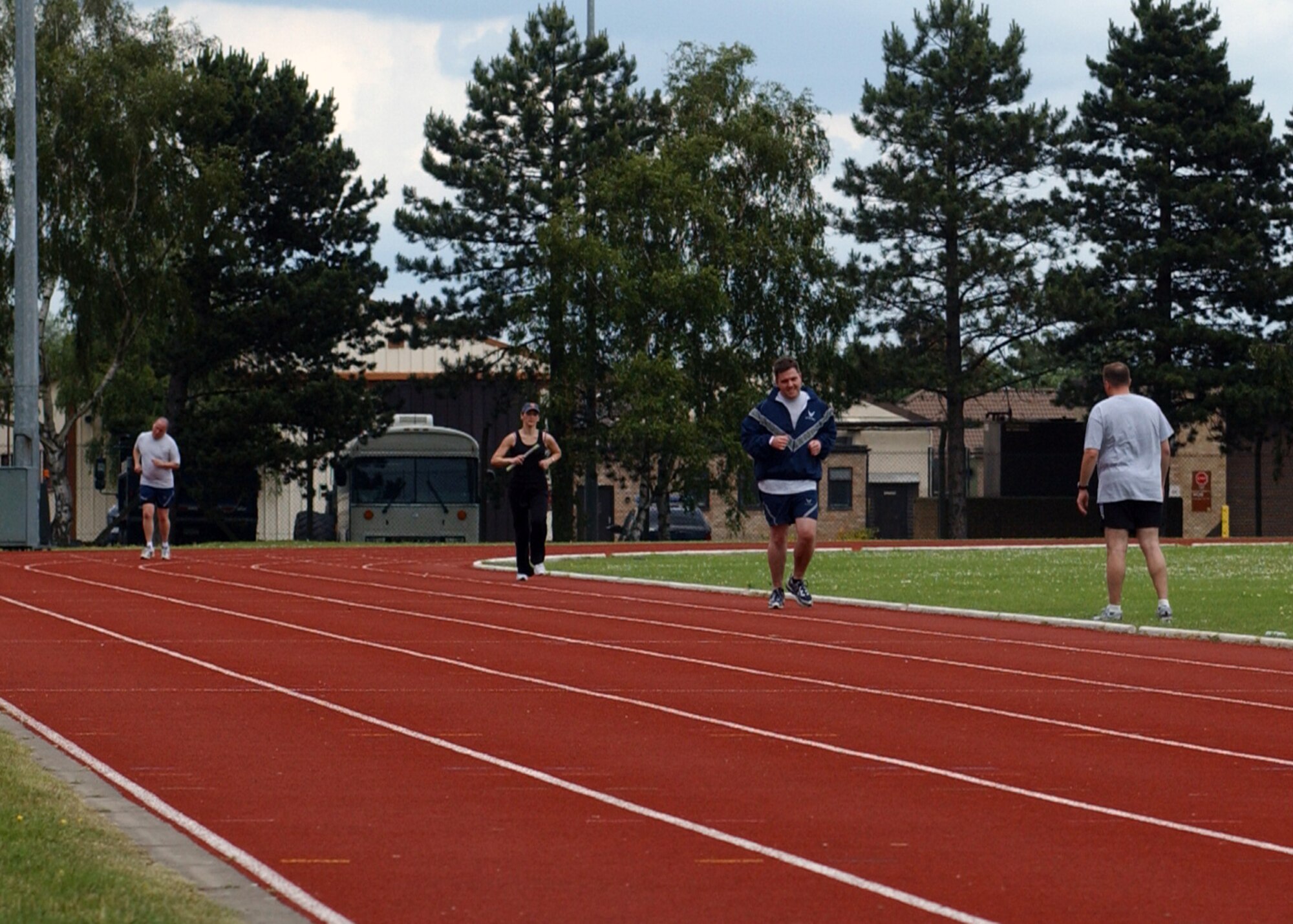 Airmen from the 48th Security Forces Squadron run around the track at RAF Lakenheath, England June 20 to 21 as part of a 24-hour run named “The Senior Airman Nathan Run.” The run was dedicated to the memory of Senior Airman Jason Nathan, 48th SFS, who recently lost his life in Iraq in the line of duty. (U.S. Air Force photo by Airman 1st Class Kristopher Levasseur)