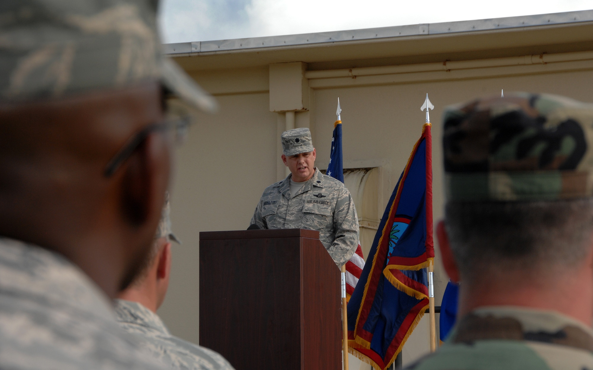 Lt. Col. Joe Hayslett speaks on his  views during the 36th Mobility Response Squadron change of command ceremony here June 27.  During his speech, Airmen listen intently to what their new commander expects of them. (U.S. Air Force photo by Airman 1st Class Courtney Witt)