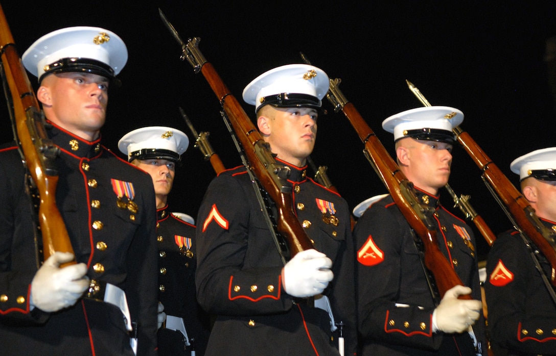 U.S. Marines march in perfect formation during Pass in Review of the evening parade at the Marine Barracks Washington, D.C., June 27, 2008. Defense Secretary Robert M. Gates was the guest of honor for the event.  