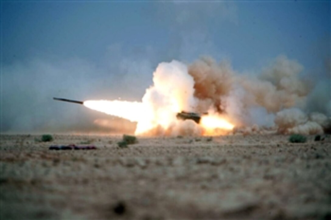 Soldiers assigned to Tango Battery, 5th Battalion, 11th Marine Regiment, launch a practice rocket from a range on Asad Air Base in Iraq's Anbar province, June 28, 2008.   