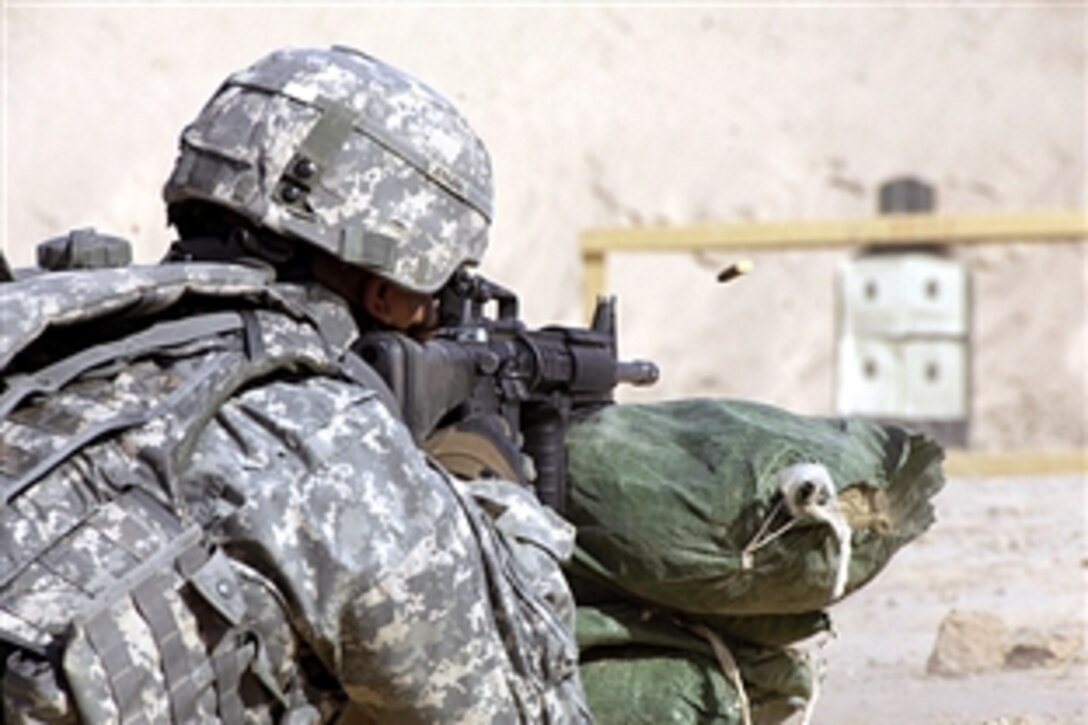 U.S. Army Staff Sgt. Anthony Jensen fires from the prone-supported position during bi-annual marksmanship qualification on Contingency Operating Base, Speicher, Iraq, June 26, 2008. U.S. Soldiers must score at least 26 out of 40 hits in order to qualify with their individually-assigned weapons. The soldiers are assigned to Company A, Special Troops Battalion, 1st Armored Division. 