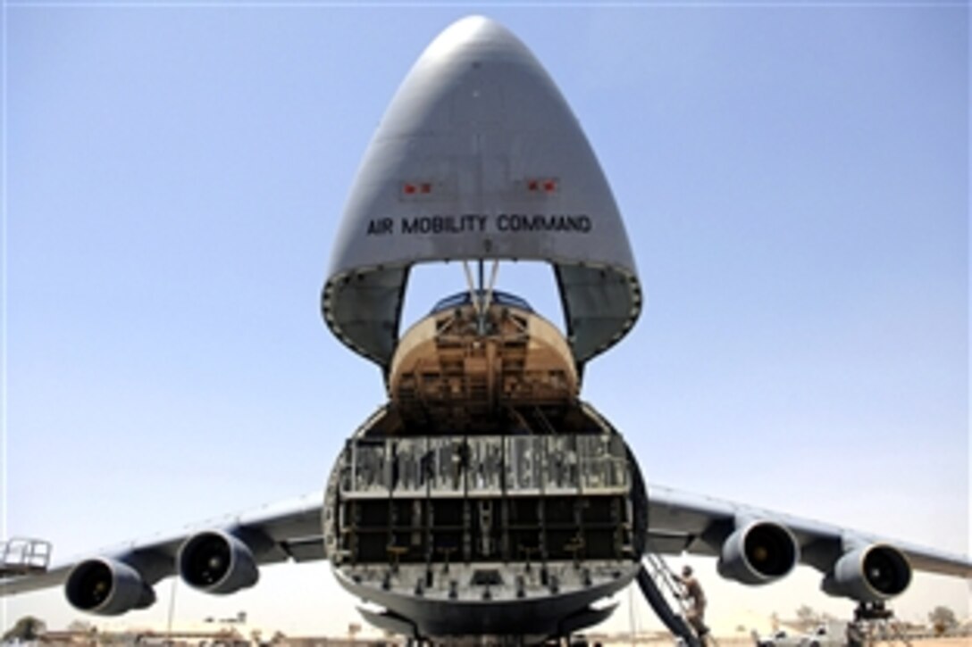 A C-5 Galaxy sits with its nose up ready for U.S. soldiers to load an Army Stryker Infantry Carrier Vehicle aboard on Joint Base Balad, Iraq, June 25, 2008. The final destination for the tactical vehicle is Anniston Army Depot, Ala. 
