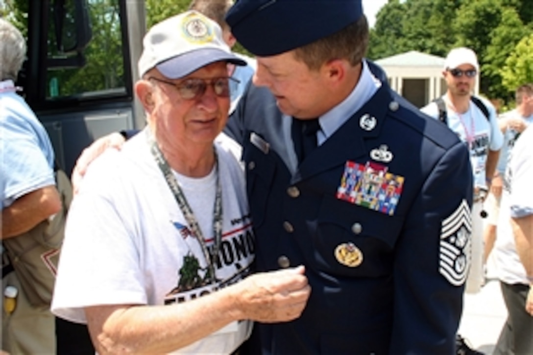 When 84-year-old U.S. Army veteran Richard McKinley visited the World War II Memorial in Washington, D.C., June 24, 2008, he didn't expect the U.S. Air Force's top enlisted man to greet him -- even if Air Force Chief Master Sgt. Rodney J. McKinley is his nephew.  The elder McKinley was pleasantly surprised at the impromptu family reunion. 