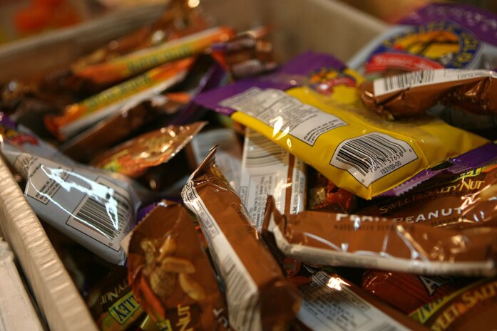 Boxes of food are collected at the chapel on Camp Ripper, Iraq, June 30.  Care packages were sent by Words of Comfort, Hope and Promise, a military outreach group in San Clemente, Calif.  Groups such as this one have been sending care packages to Regimental Combat Team 5 since the unit arrived in Iraq in January.  The care packages help raise the morale of the service members and show the support of the communities back in the states.::r::::n::