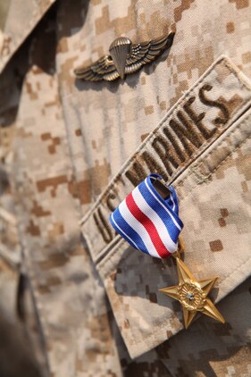 Staff Sgt. Alec Haralovich displays his Silver Star Medal, the nation?s third highest award for combat valor. After Haralovich was shot twice in his body armor by an insurgent, he destroyed an enemy stronghold with a rocket and led his Marines on a two-hour assault after their ambushers during an Afghanistan deployment in 2011. Haralovich is a reconnaissance Marine assigned to E Company, 4th Reconnaissance Bn., 4th Marine Division.