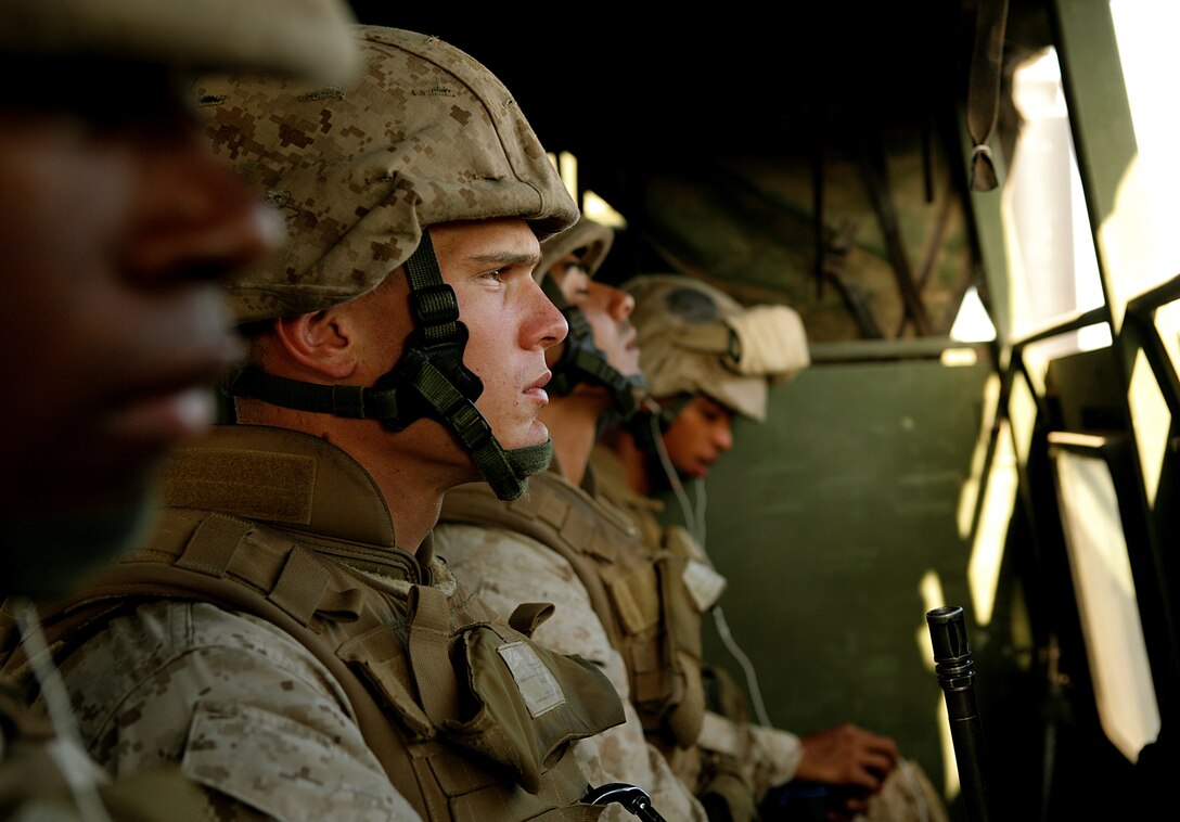 Lance Cpl. Christian J. Fischer, a gunner with 3rd Low Altitude Air Defense Battalion, stares out into the Djiboutian landscape while riding with other Marines to a live-fire training exercise.